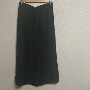 Black drawstring midi skirt with front slit and pockets. Anthropologie, M